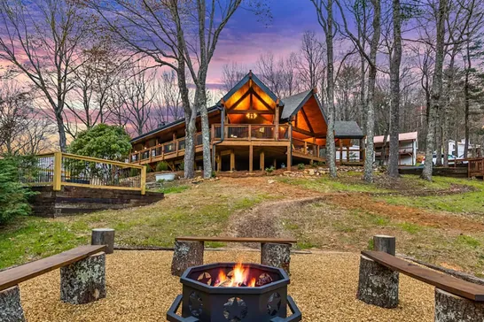 Lodge and firepit at dusk — placeholder